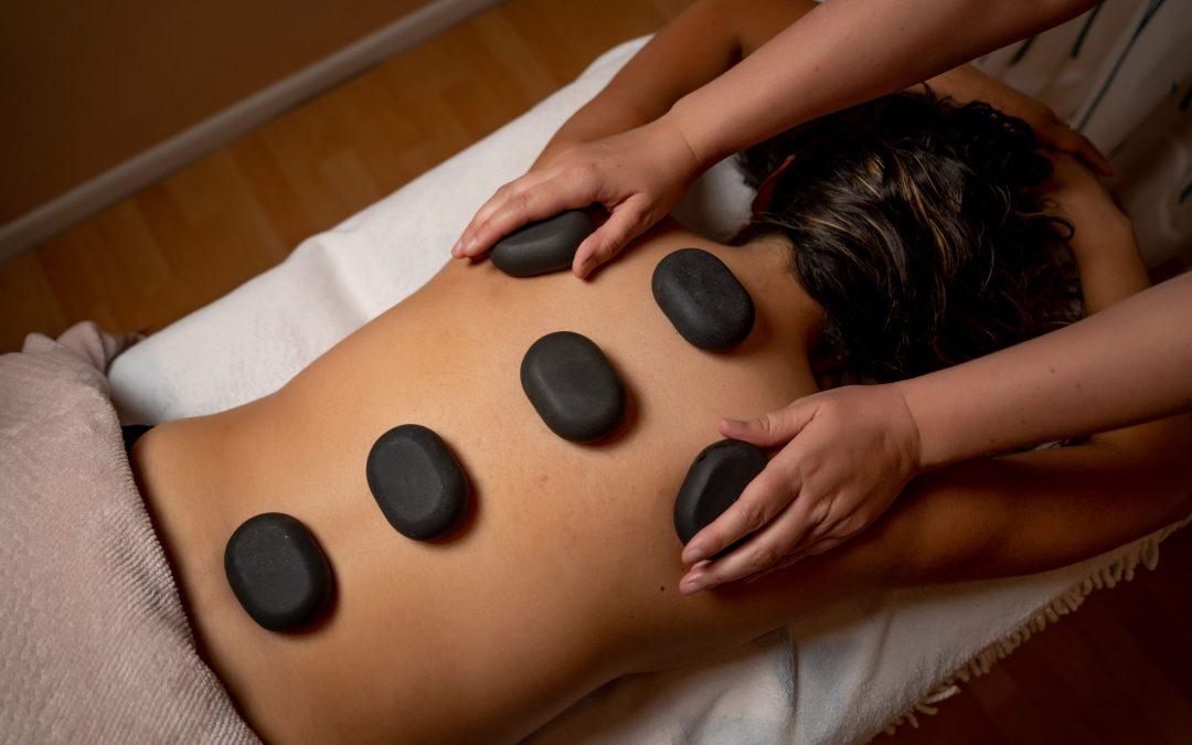Discover the Magic of Hot Stone Massages at ICONIC Beautique